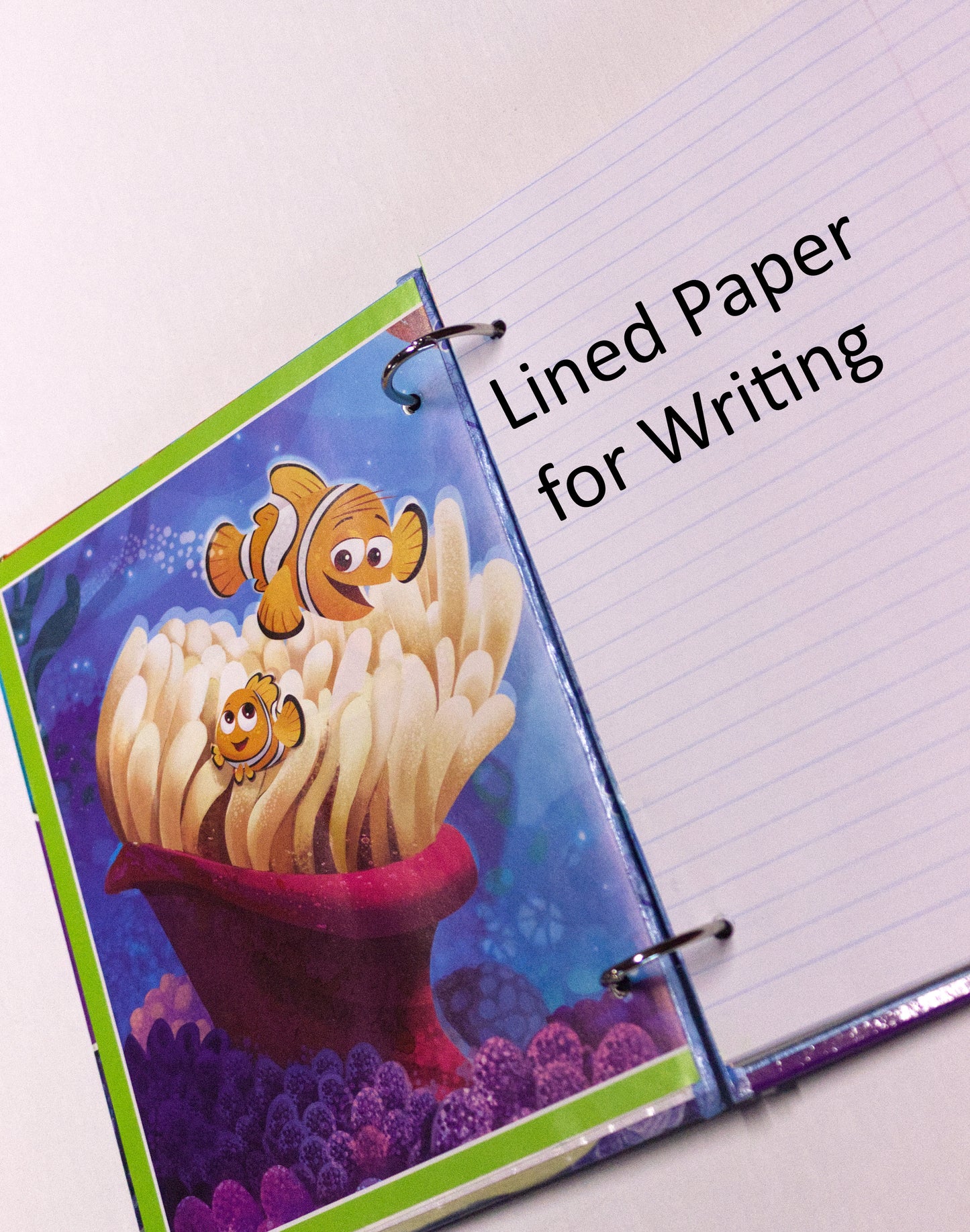 Interior pages of an upcycled The Incredibles book journal showing lined pages for journaling.