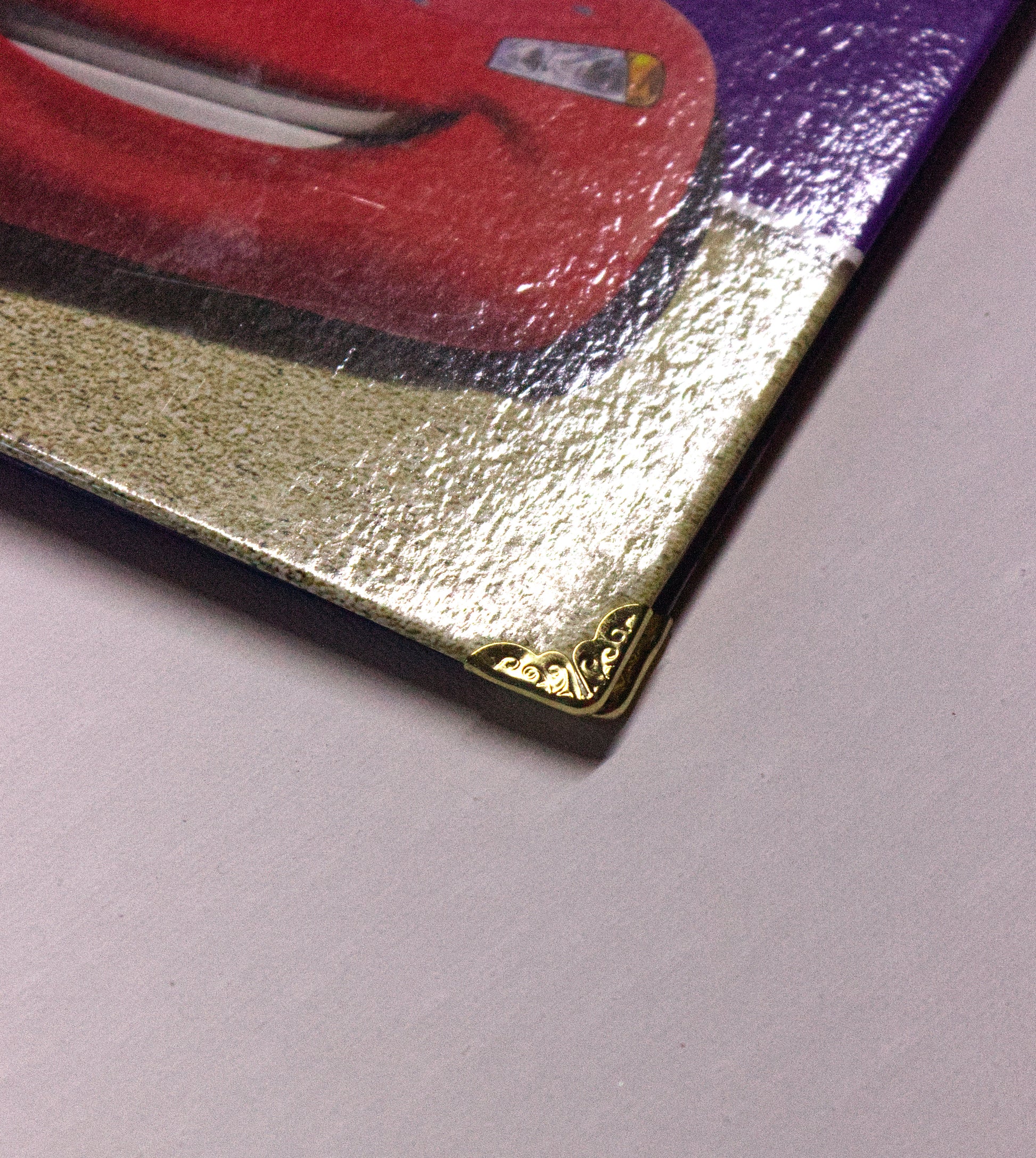 Close up on the reinforced gold corners on the Cars handmade Upcycled book journal