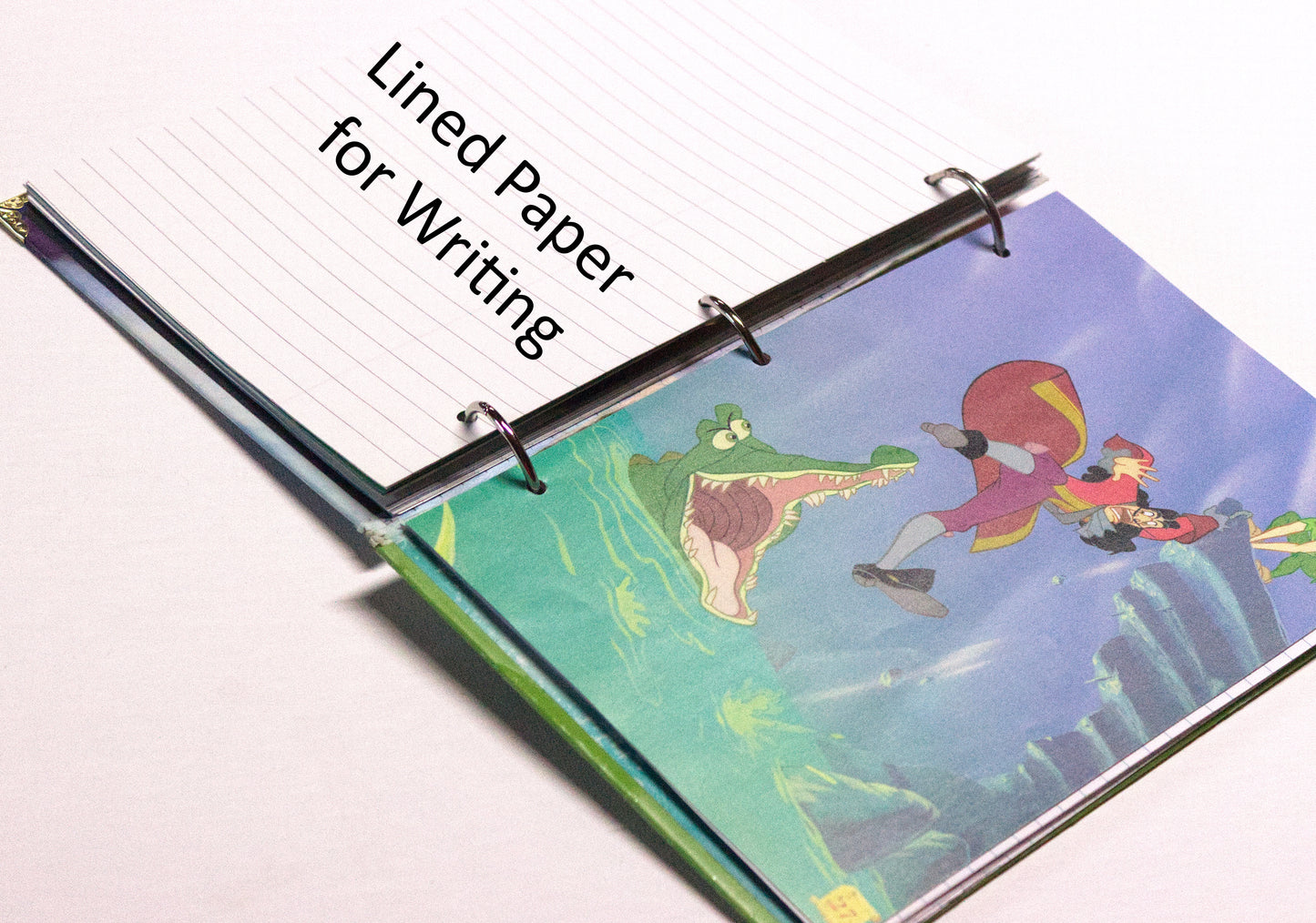 Interior pages of an upcycled Peter Pan book journal showing lined pages for writing