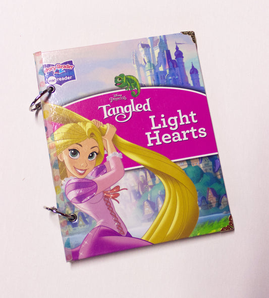 Upcycled children’s book journal made from Tangled Lights Hearts hardcover, featuring Rapunzel on the front cover.
