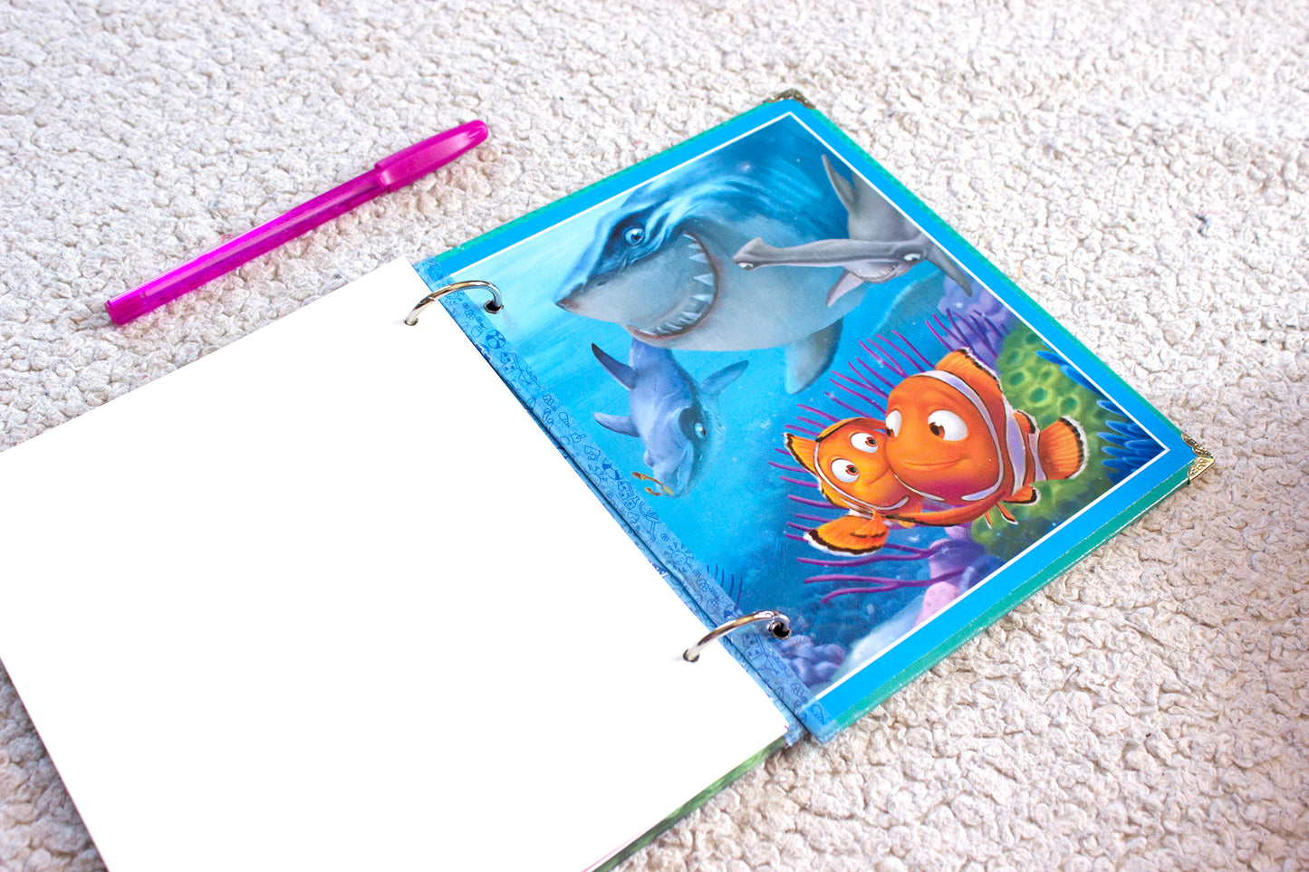 Interior pages of an upcycled Finding Nemo book journal showing blank pages for journaling and sketching.